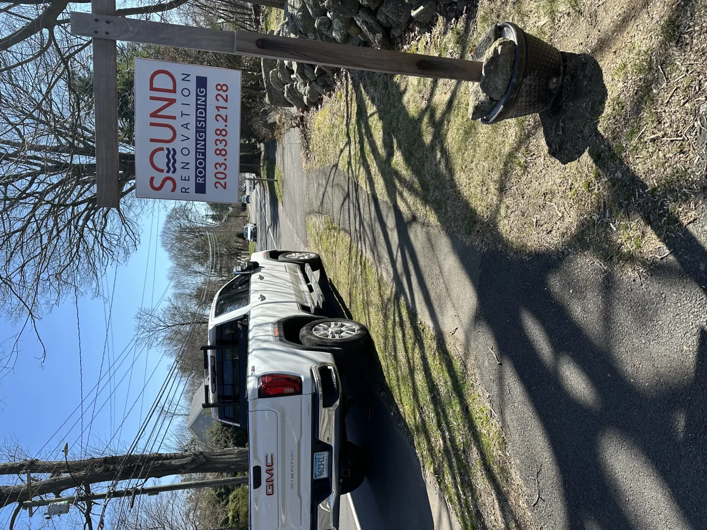 A Sound Renovation sign in a yard of a satisfied customer.