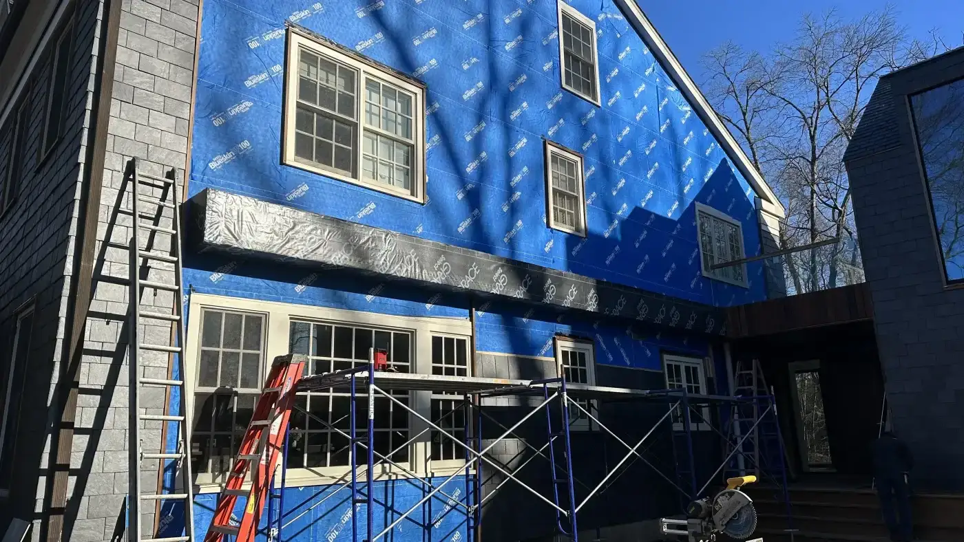 A wide view of an in-progress Sound Renovation siding project.