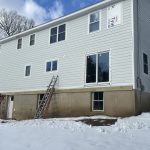 A wide view of a wintertime Sound Renovation worksite.