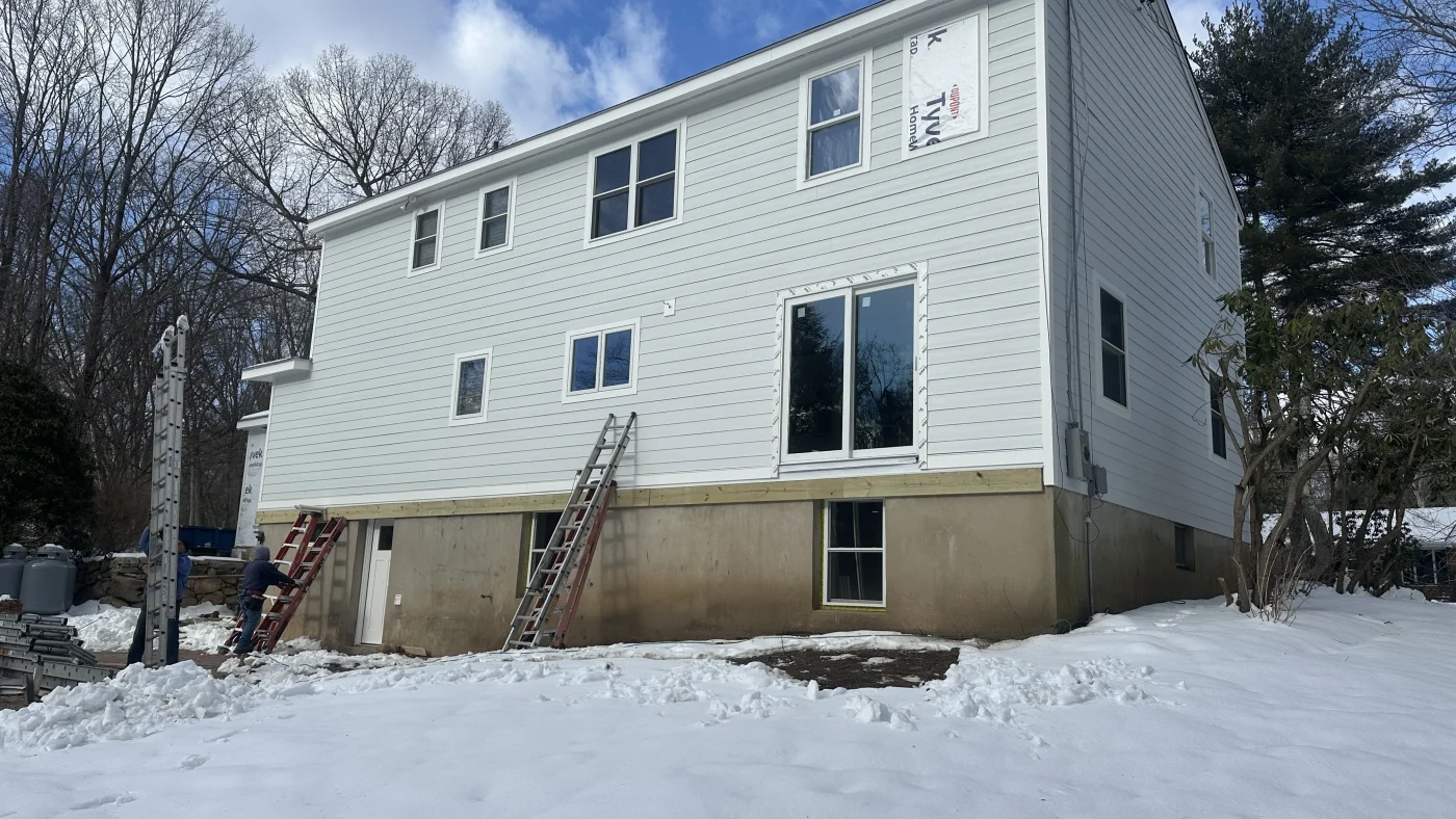 A wide view of a wintertime Sound Renovation worksite.
