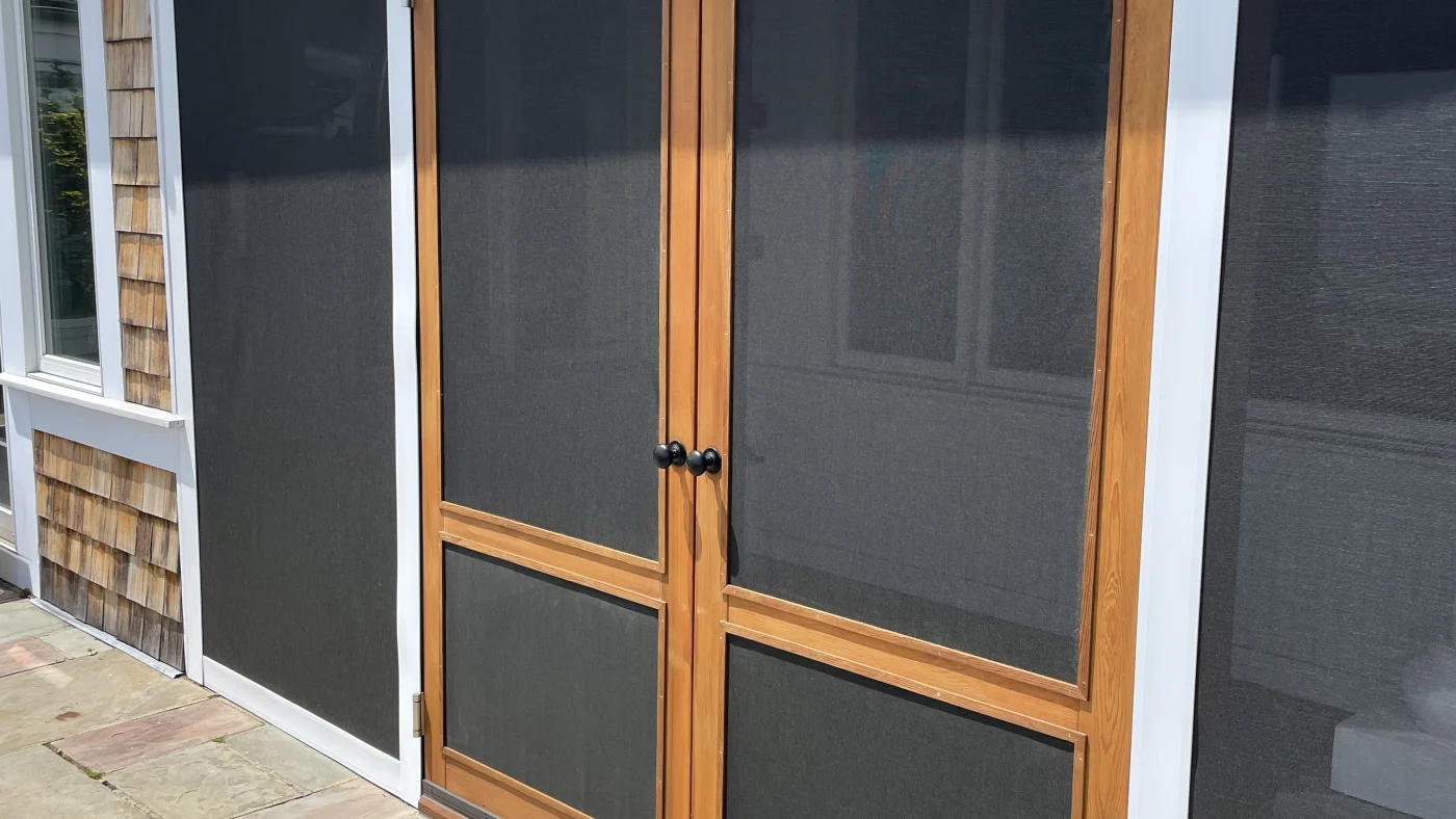 A tight shot of the wooden outer door installed on one of the entries to a local home.