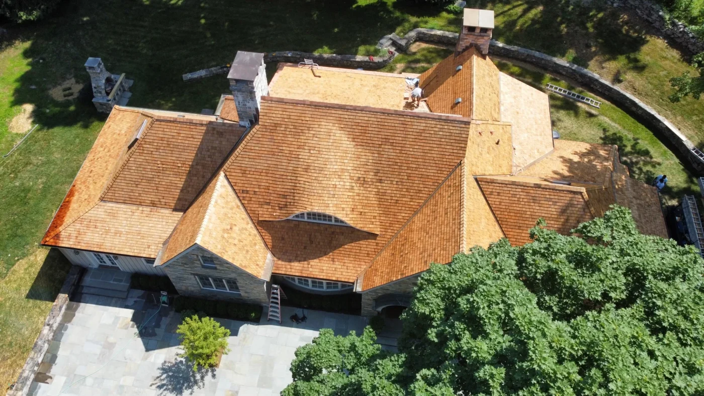 A natural colored GAF roof replaced on a home.