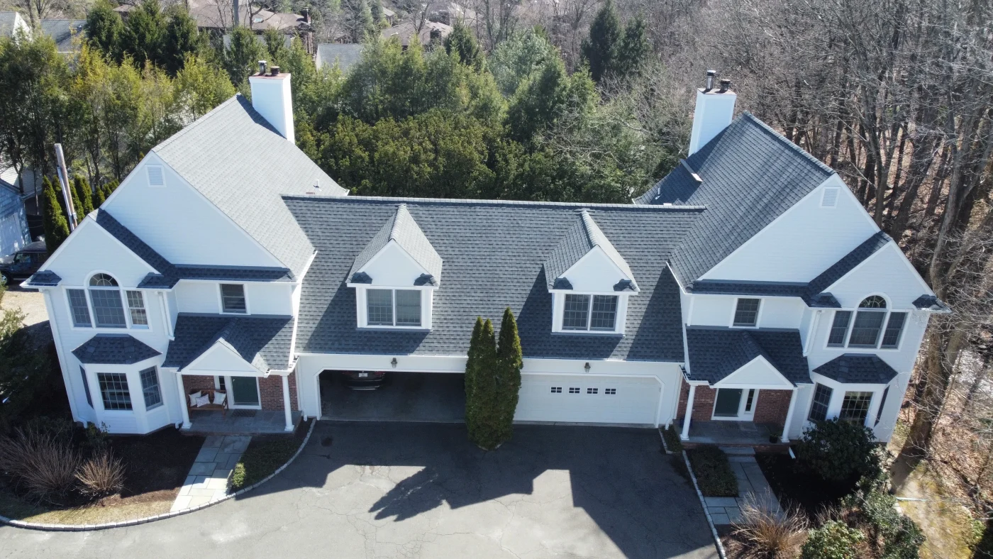 A dark asphalt roof from GAF installed on a home by Sound Renovation.