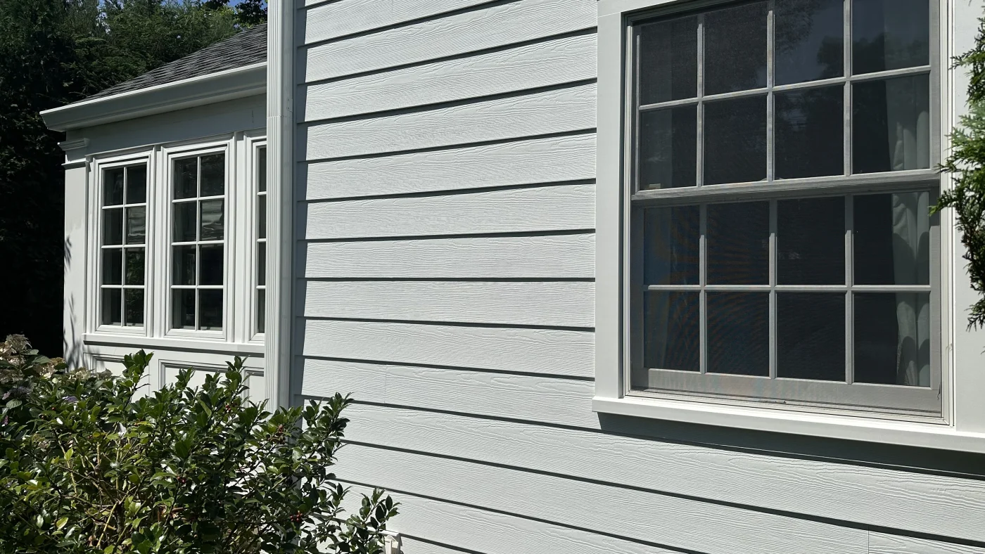A close view of the newly installed vinyl siding on the wall of a local home.
