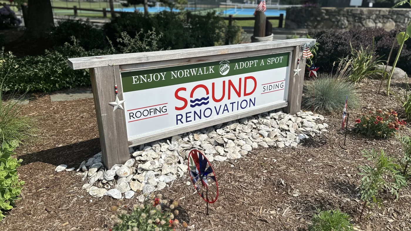 A close-up view of the Sound Renovation sign that bypassers can see.