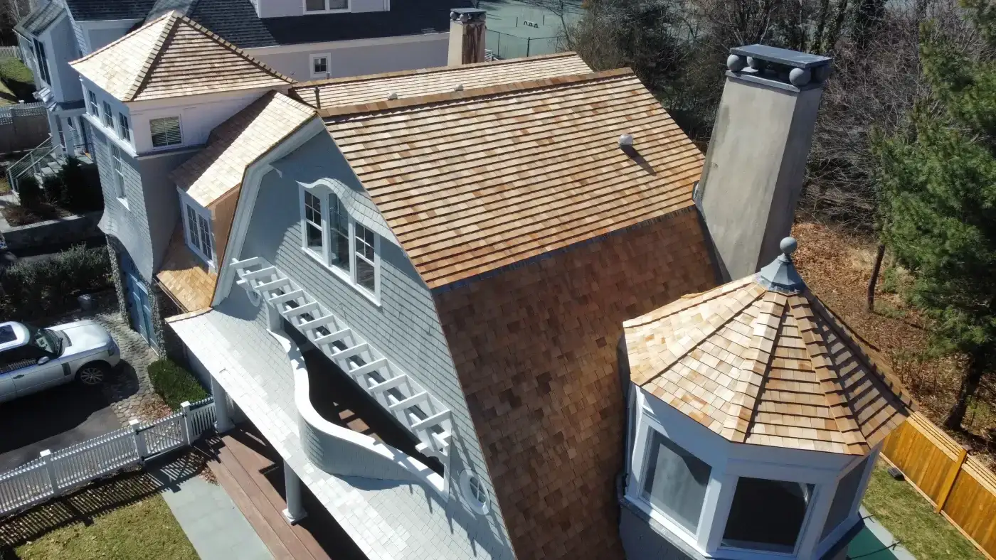 Finest Cedar Shingles Available | Fairfield County, CT | Sound Renovation An angled overhead view of a large local home with its new premium cedar roof installed.