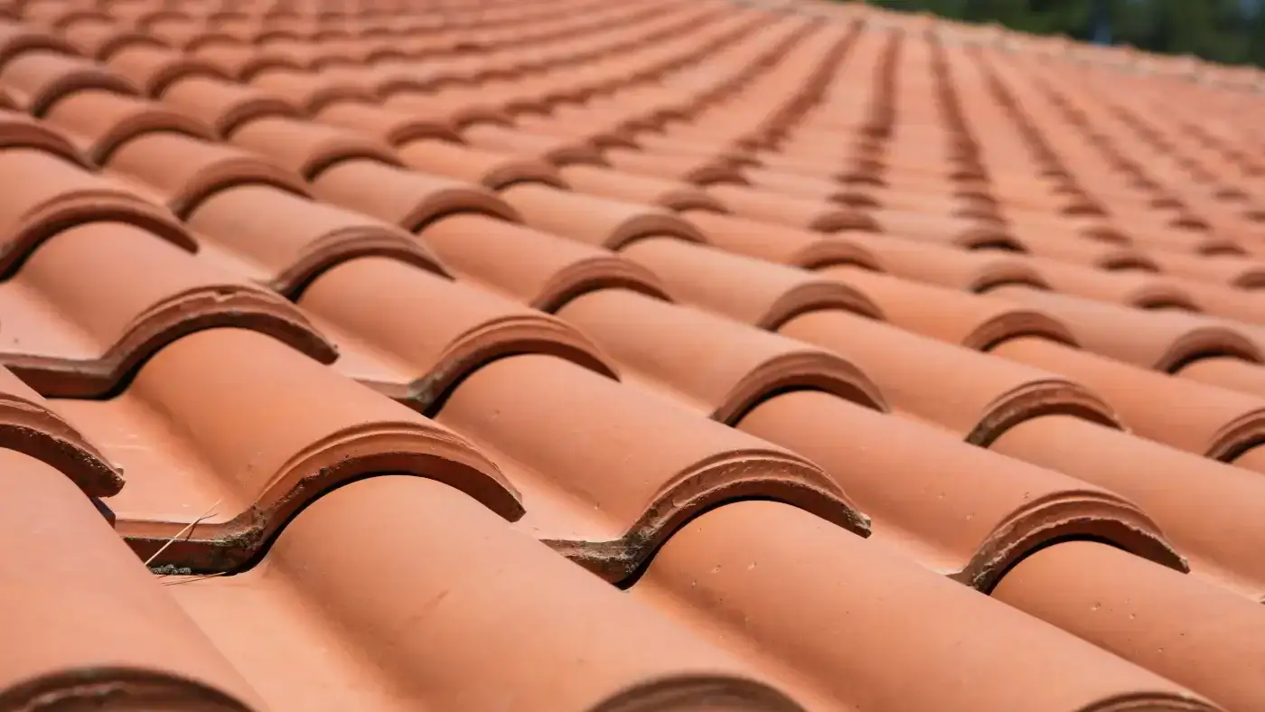 Genuine Ludowici Tile Roofing | Fairfield County, CT | Sound Renovation A close-up view of a section of newly installed terra cotta tile roofing.