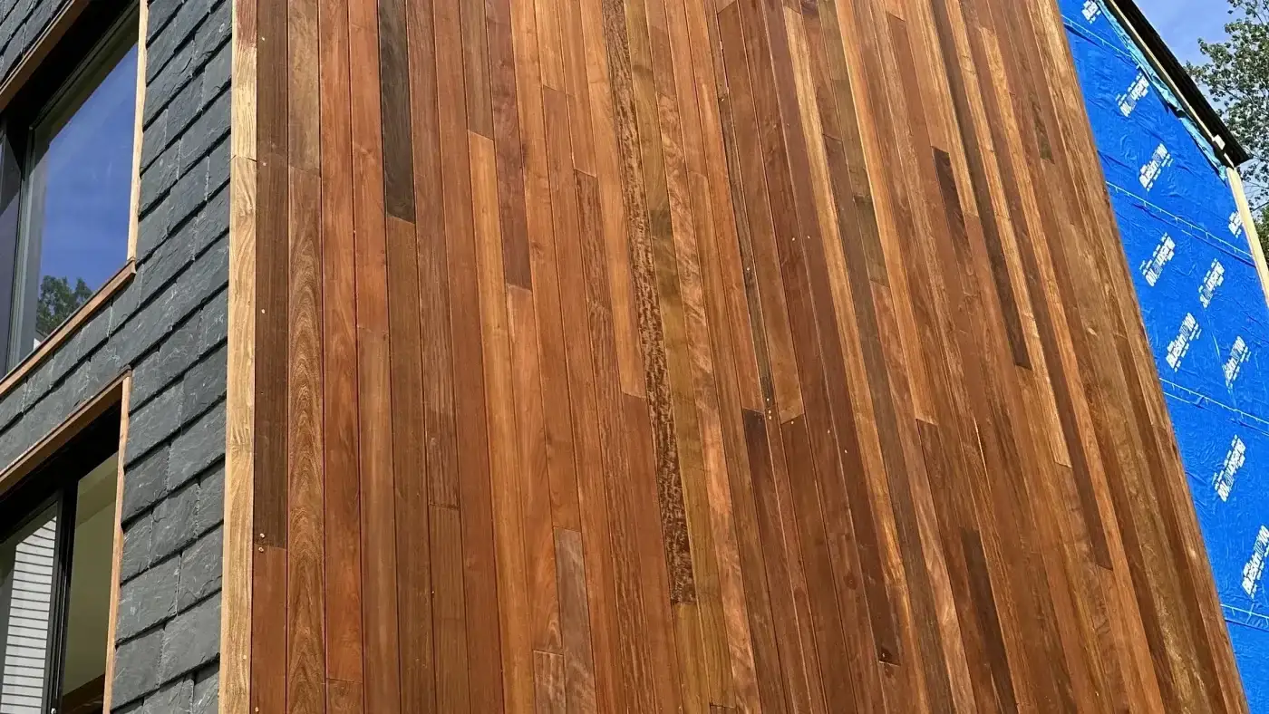 A close view of an in-progress installation of Maibec cedar siding on a local home.