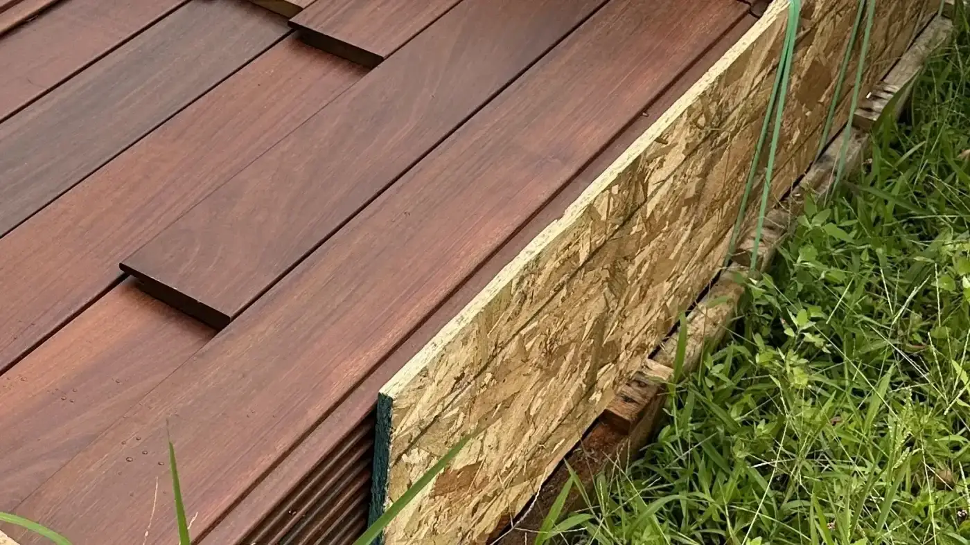 A close-up view of Maibec cedar siding boards on-site at a Sound Renovation project.