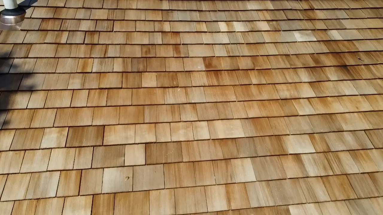 A close-up view of a cedar roof installed on a home.