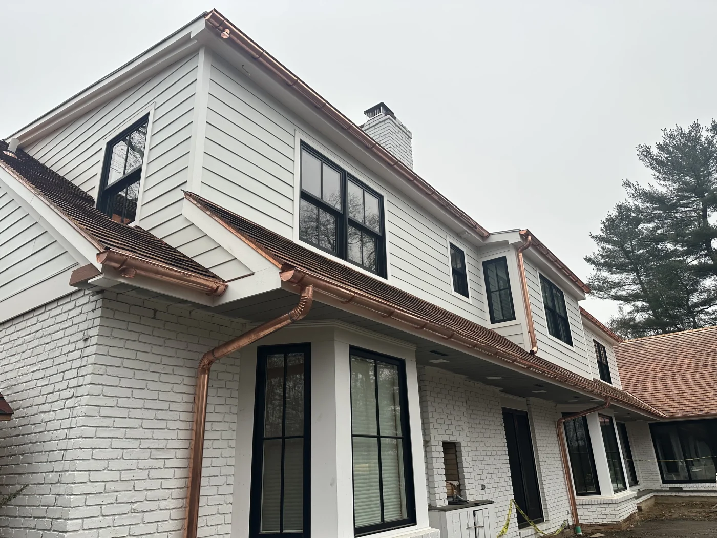 A home with all newly installed black-framed windows.