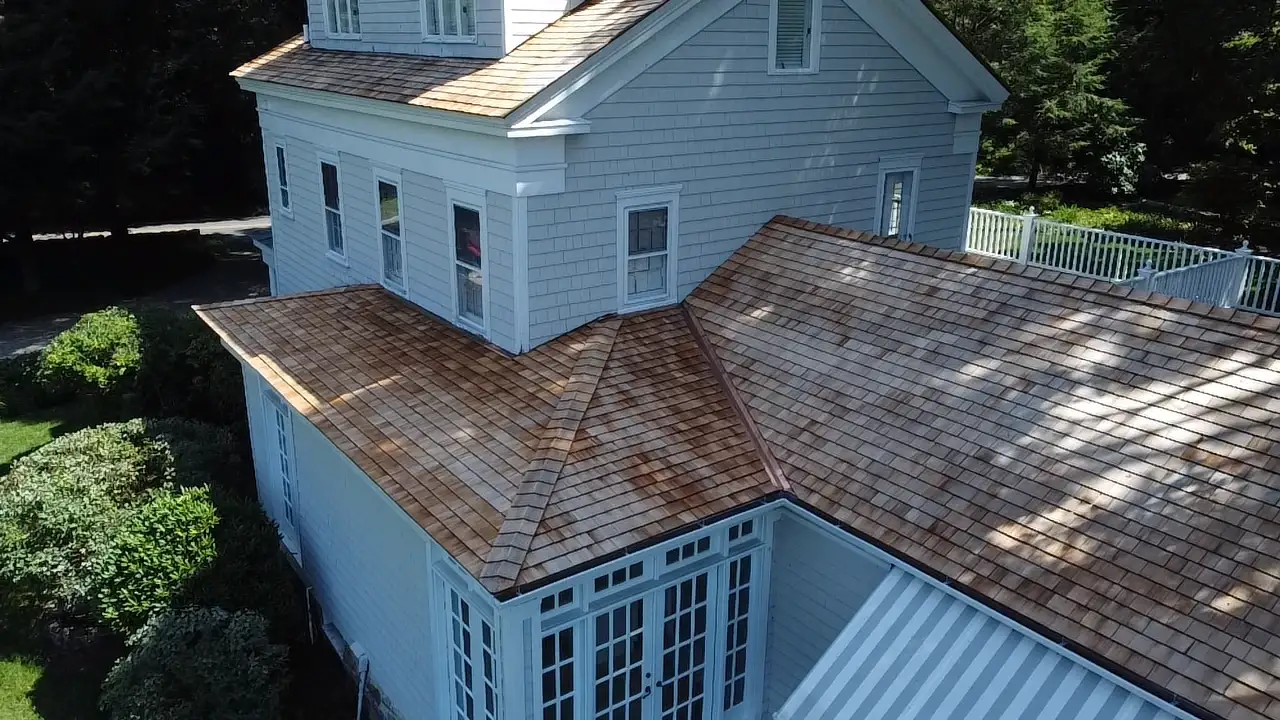 Residential Roofing - Wood Siding | Wilton - Fairfield County, CT | Sound Renovation A close, elevated, and angled view of a local home with new roofing and siding by Sound Renovation.