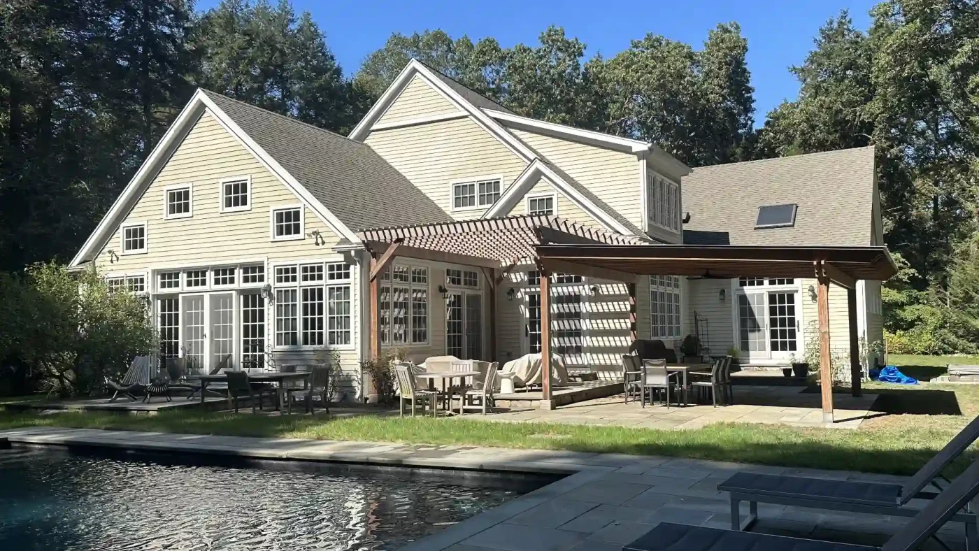 A wide view of the rear of a local home that’s undergone a Sound Renovation siding replacement.