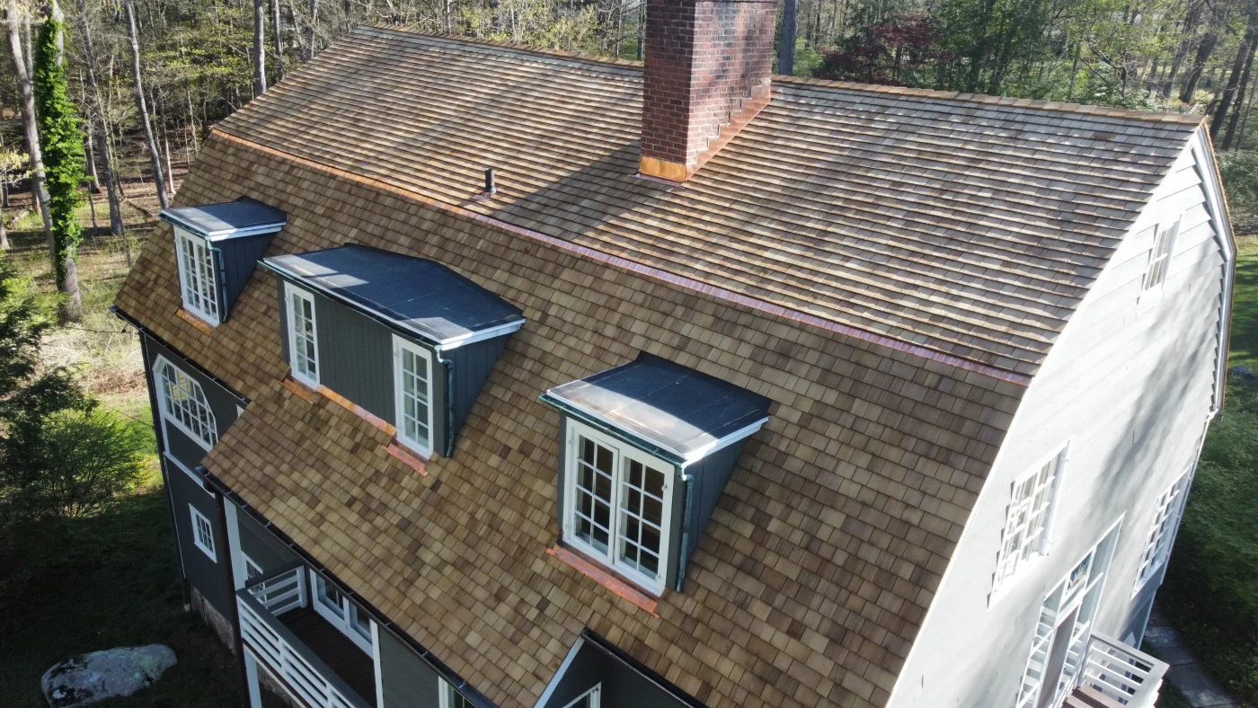 Super Residential Roof Replacement In Weston, CT | Sound Renovation A cedar roof installed on a two-story home.