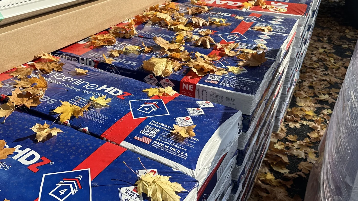 Superior GAF Asphalt Shingles | Fairfield County, CT | Sound Renovation A close view of a line of GAF Timberline HDZ shingle bundles waiting on a Sound Renovation job site.