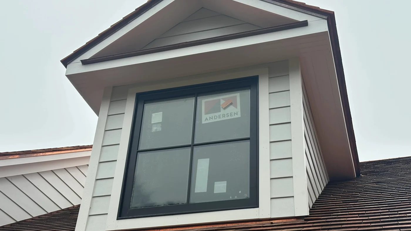 Superior Window Replacement Options | Fairfield County, CT | Sound Renovation A ground-level close-up view of a new Andersen window installed in the gable of a local home.