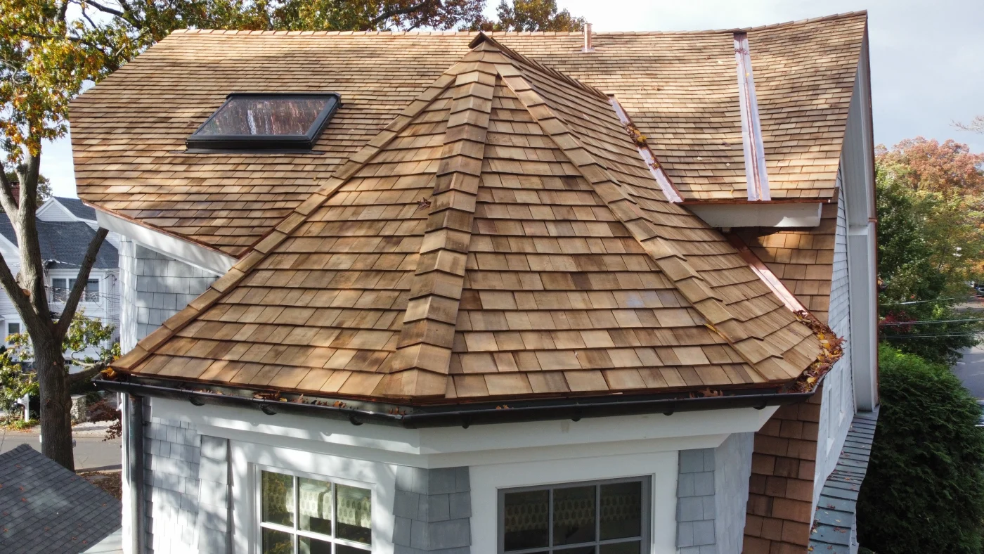 An eye-level view of the new cedar roof and custom-fabricated metal work on a local home.
